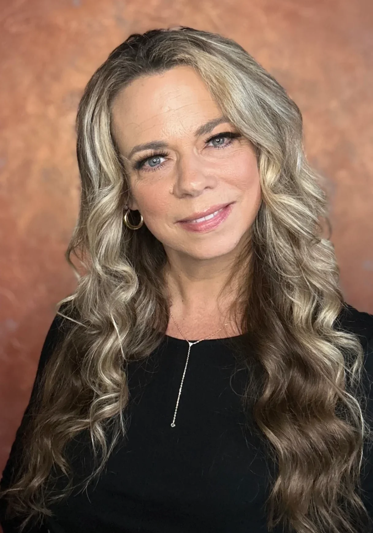 Middle-aged woman with curled hair